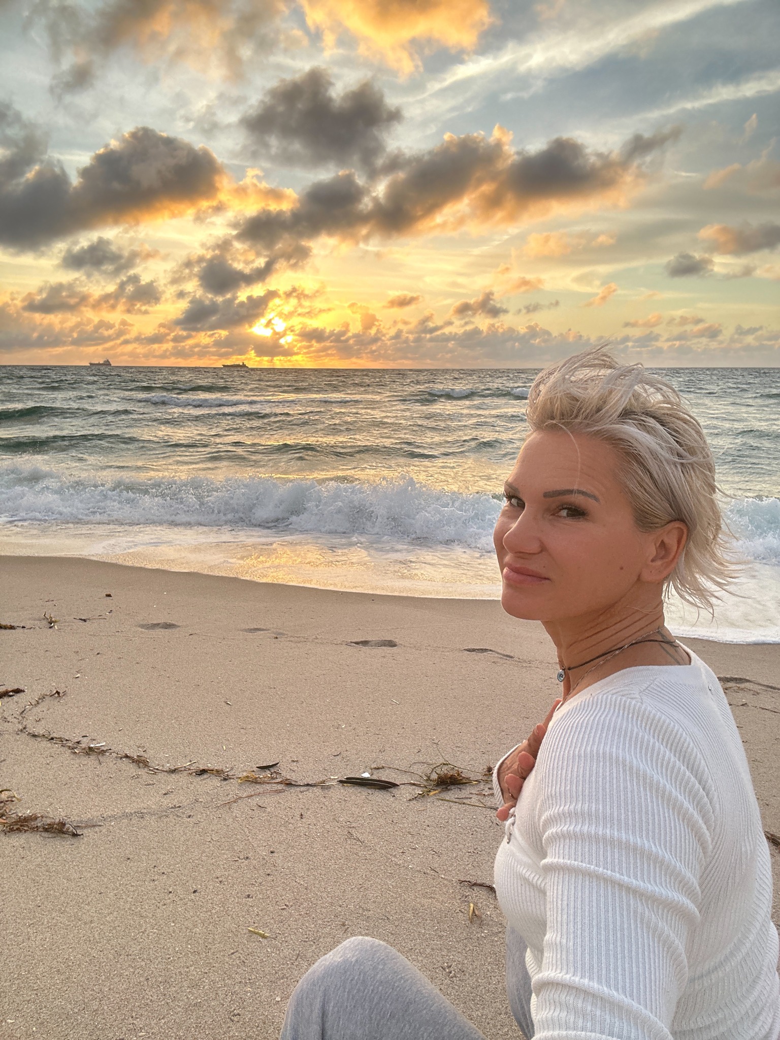 Gabriella on the beach at sunrise